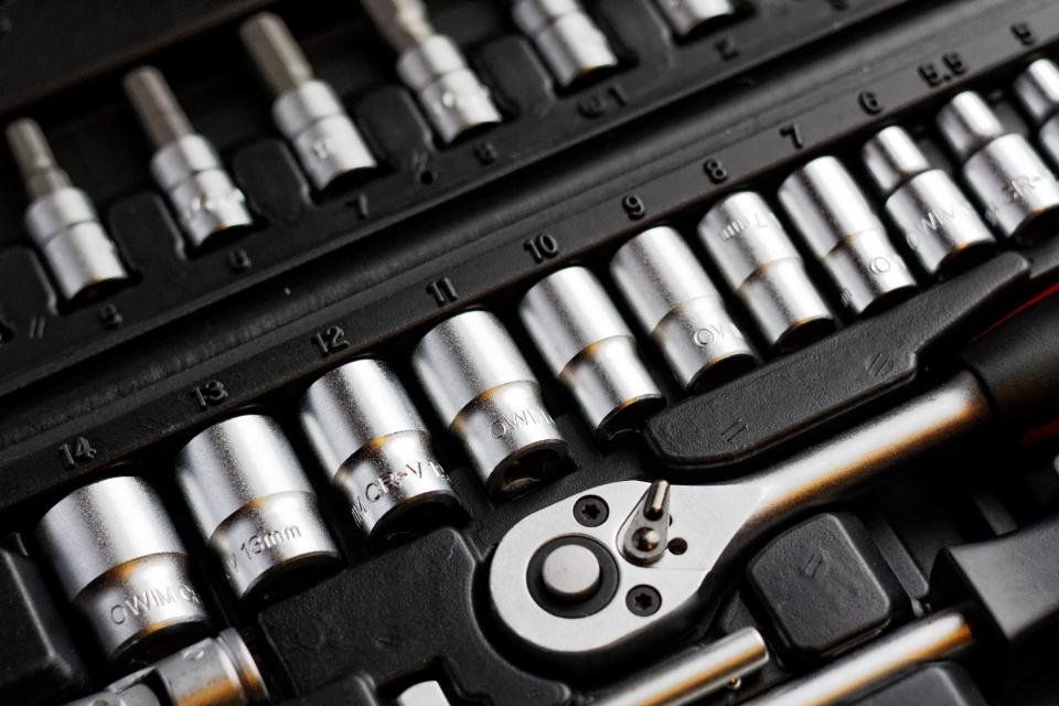 A socket wrench set laid out in its case
