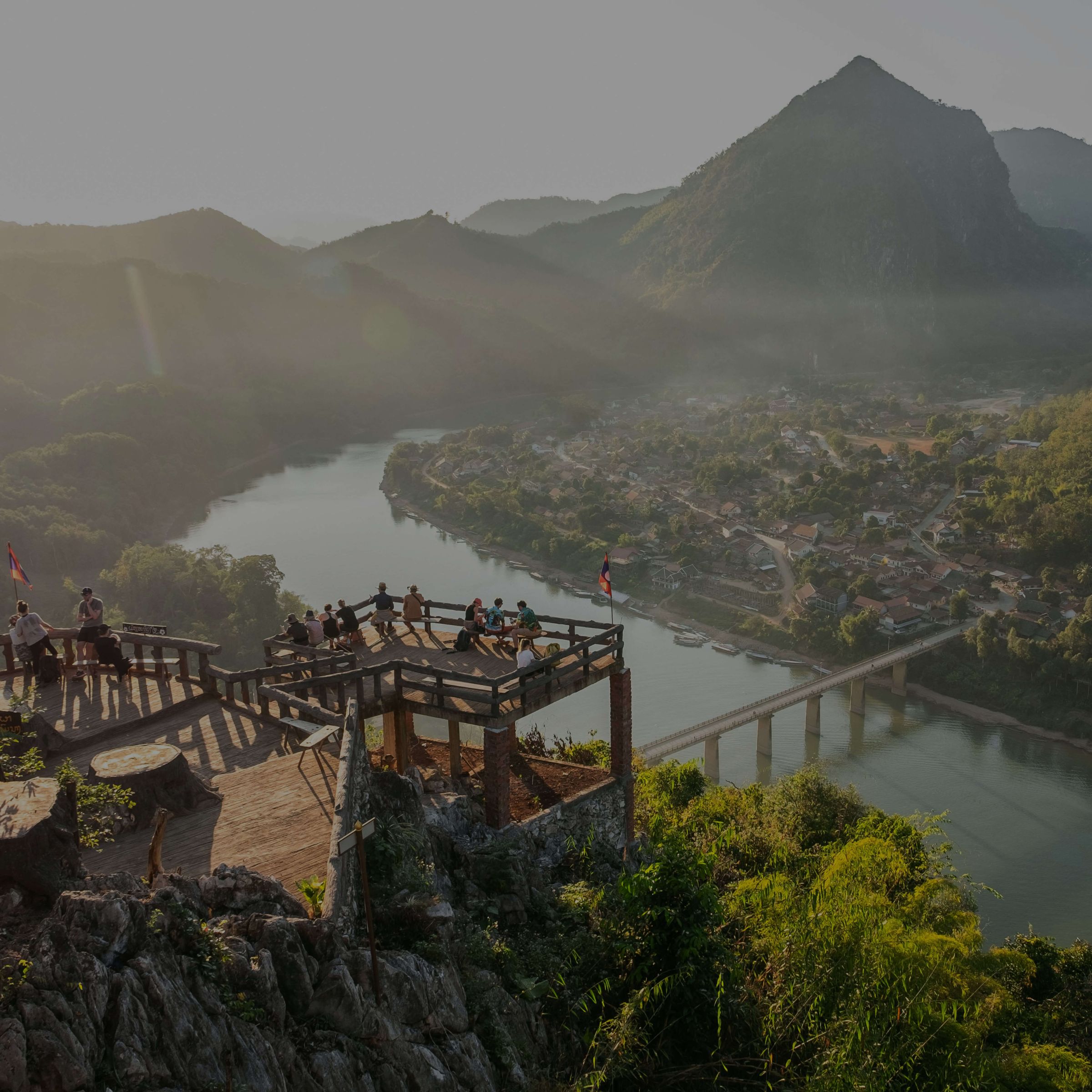 A viewpoint over a river winding through mountains in northern Laos
